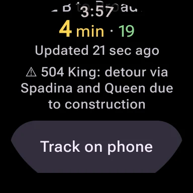 A stop on the watch scrolled down: 4 min, then 19, updated 21 sec ago, and a warning that the 504 King is on detour via Spadina and Queen due to construction, with a Track on phone button